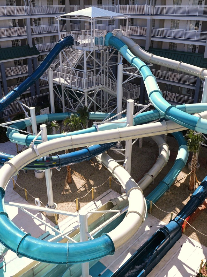 Holiday Inn Resort Orlando Suites Waterpark exterior with intertwined waterslides between hotel buildings
