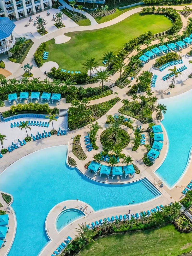 Aerial view of the pool deck and Fins Up Beach Club at Margaritaville Resort Orlando in Kissimmee