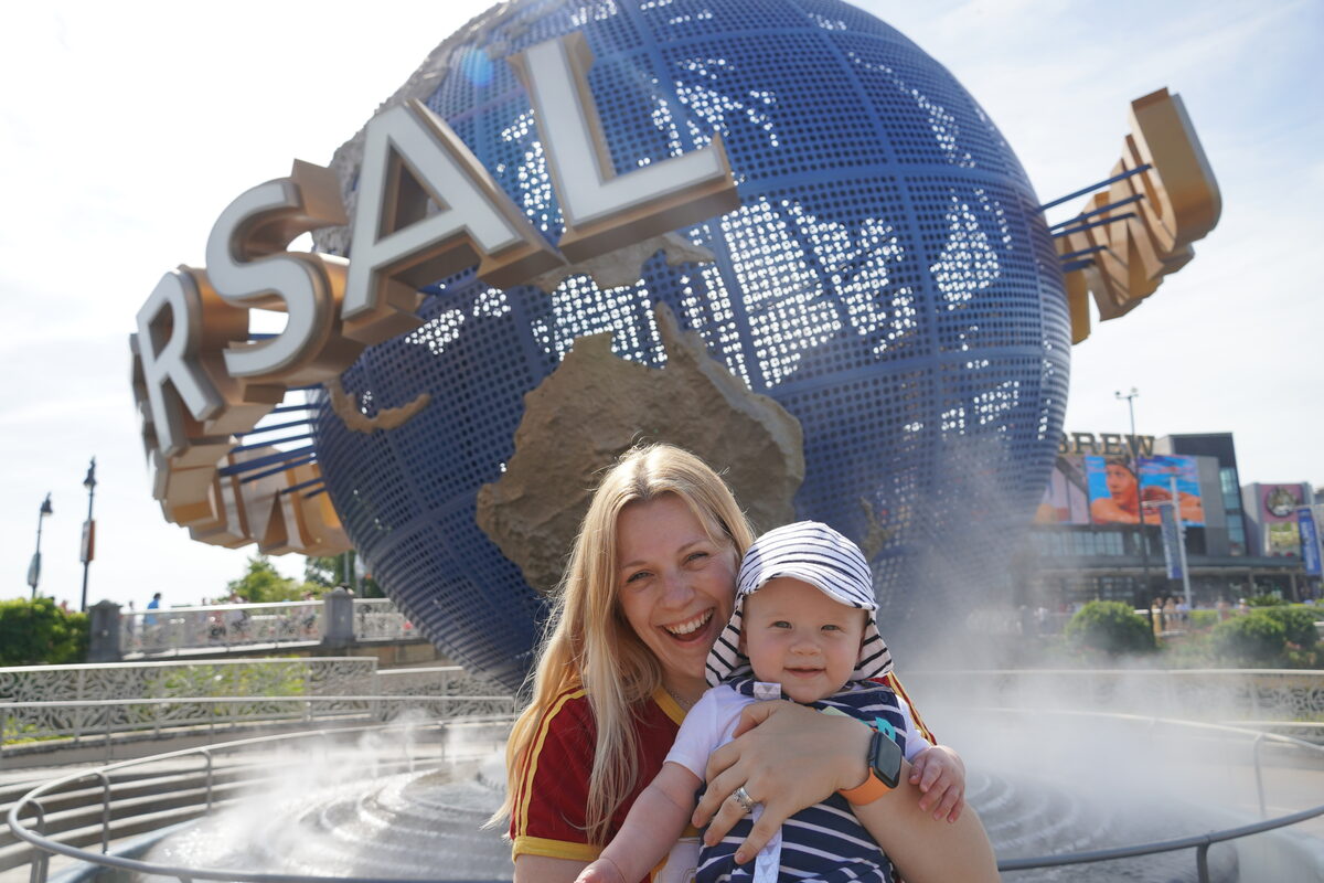 Helen and Oliver in front of the Universal Studios Orlando globe sign