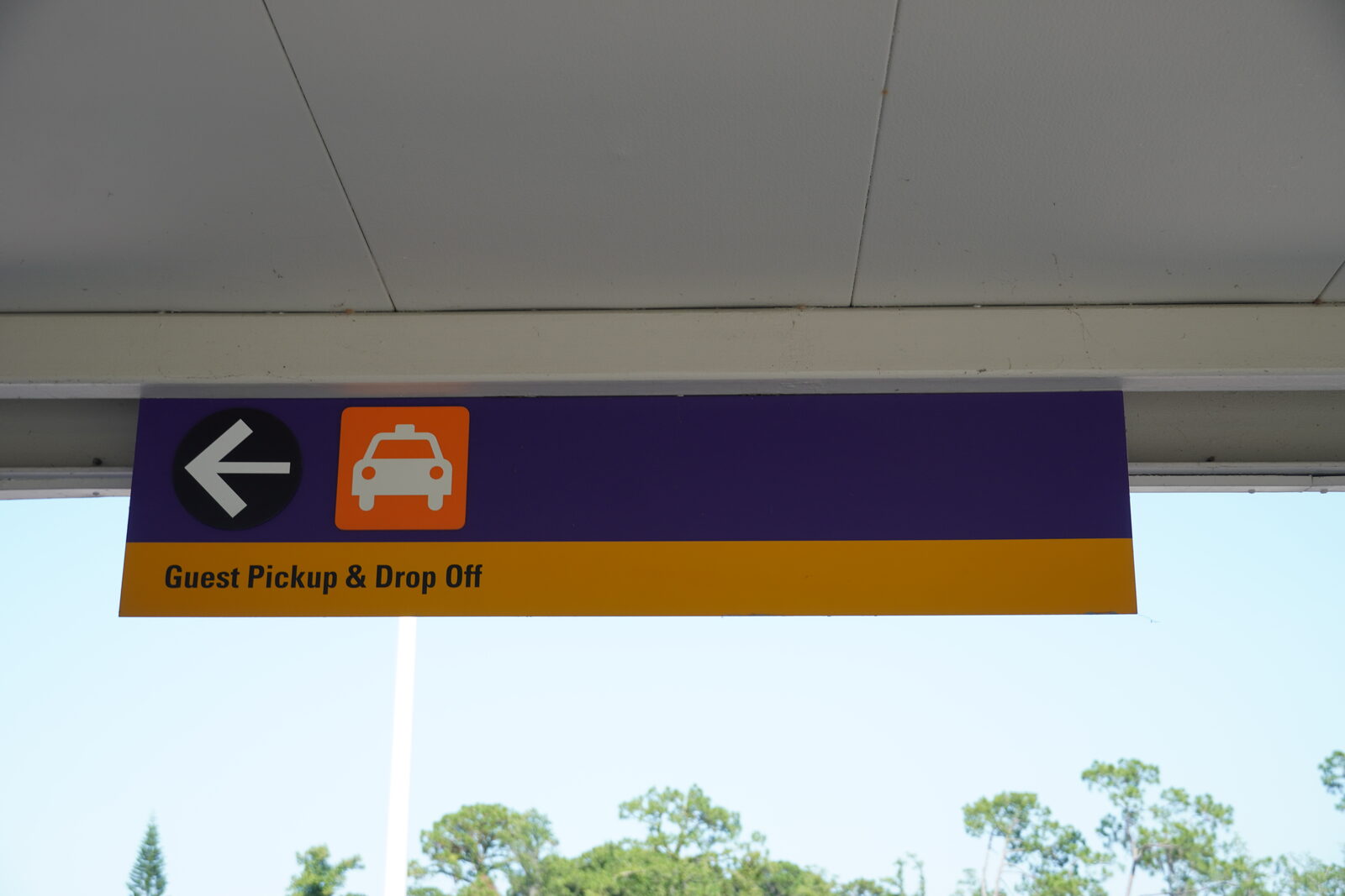 Sign at the Walt Disney World Transportation and Ticket Center directing Uber and Lyft passengers to the pickup zone