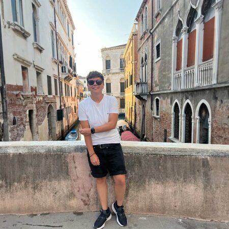Cora posing on a bridge in Venice, Italy