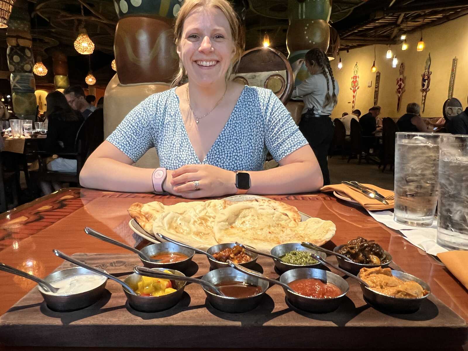 Helen looking at the signature bread service tasting board at Sanaa, Disney's Animal Kingdom Lodge