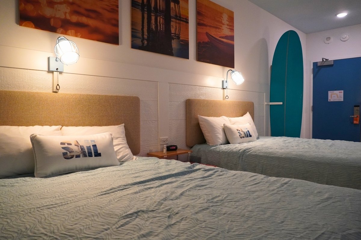 Two beds in the main bedroom of a Dockside Inn family suite at Universal's Endless Summer Resort
