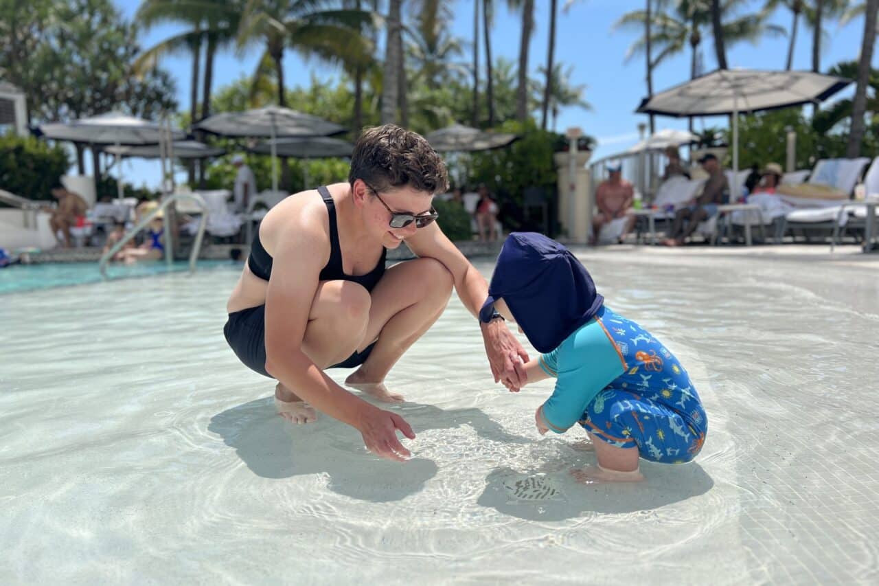 Cora and Oliver in the swimming pool at Loews Miami Beach Hotel
