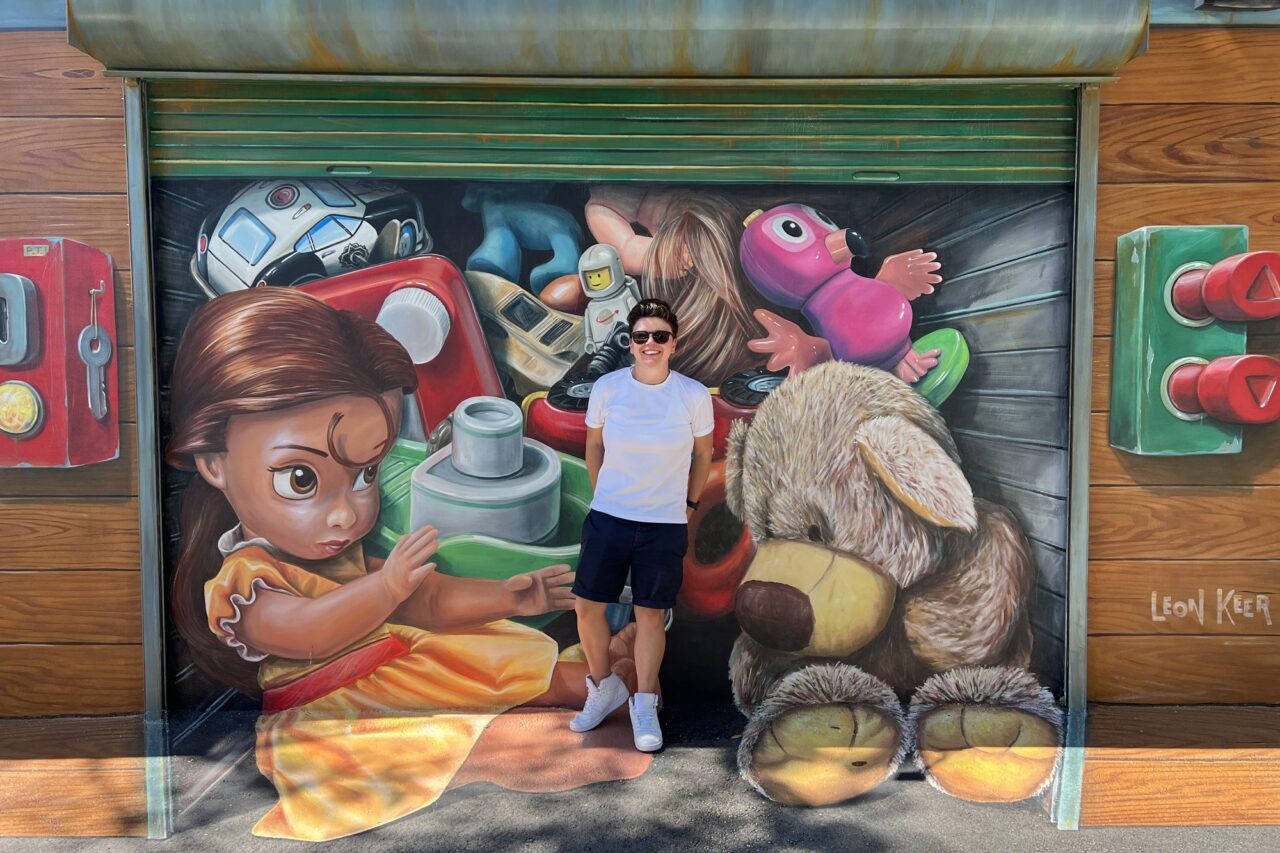 Cora in front of a mural at Wynwood Walls in Miami