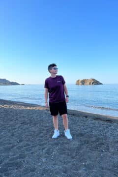 Cora on the beach at Skala Eressos on a solo trip to Lesvos, Greece