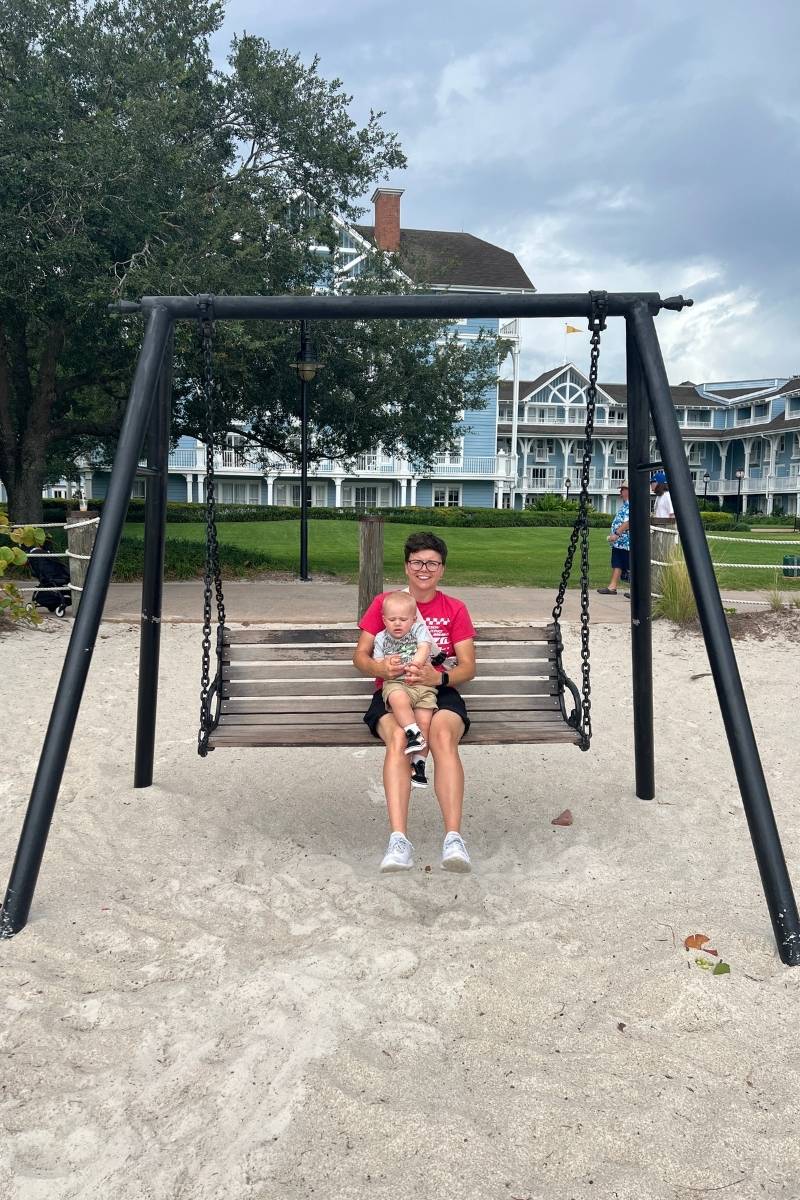 Cora and Oliver on swing at Disney's Beach Club Resort, Walt Disney World