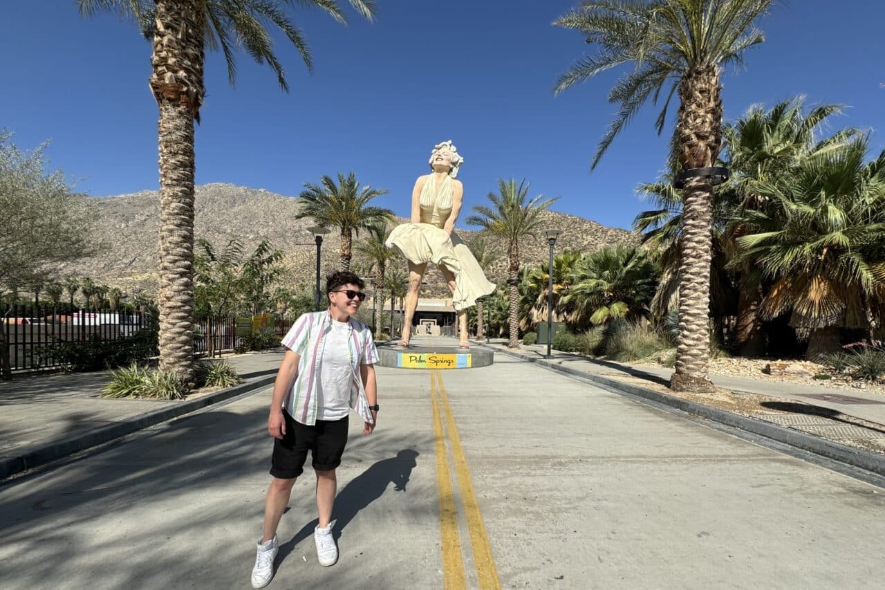 Person stood in front of a large statue of Marilyn Monroe