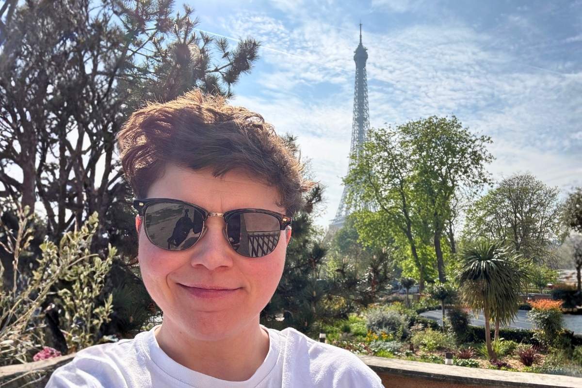 Cora in front of the Eiffel Tower in Paris