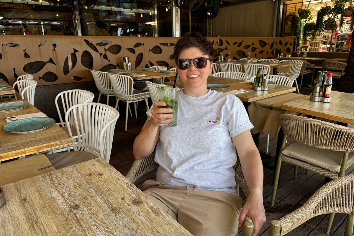 Cora enjoying a cocktail at a bar on the Salou seafront