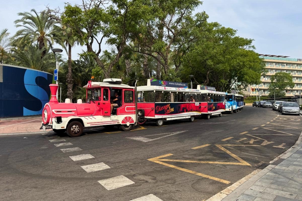 Salou tourist train travelling along the seafront promenade